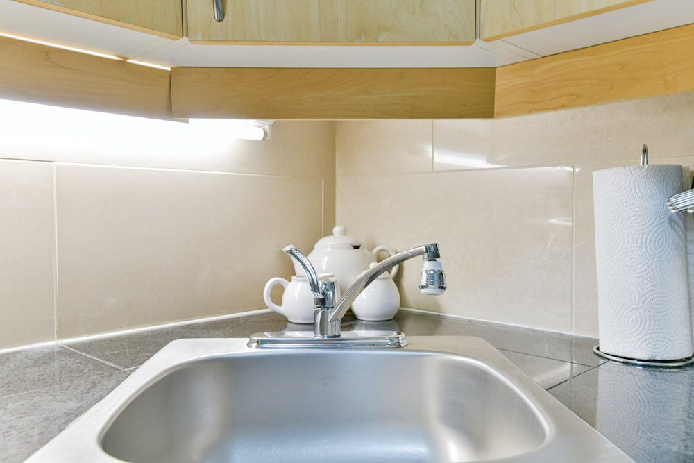 Kitchen sink of a unit at 243 Queen Street.