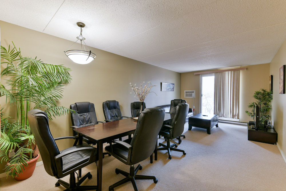 Dining room converted into a business office in a unit at 243 Queen Street.